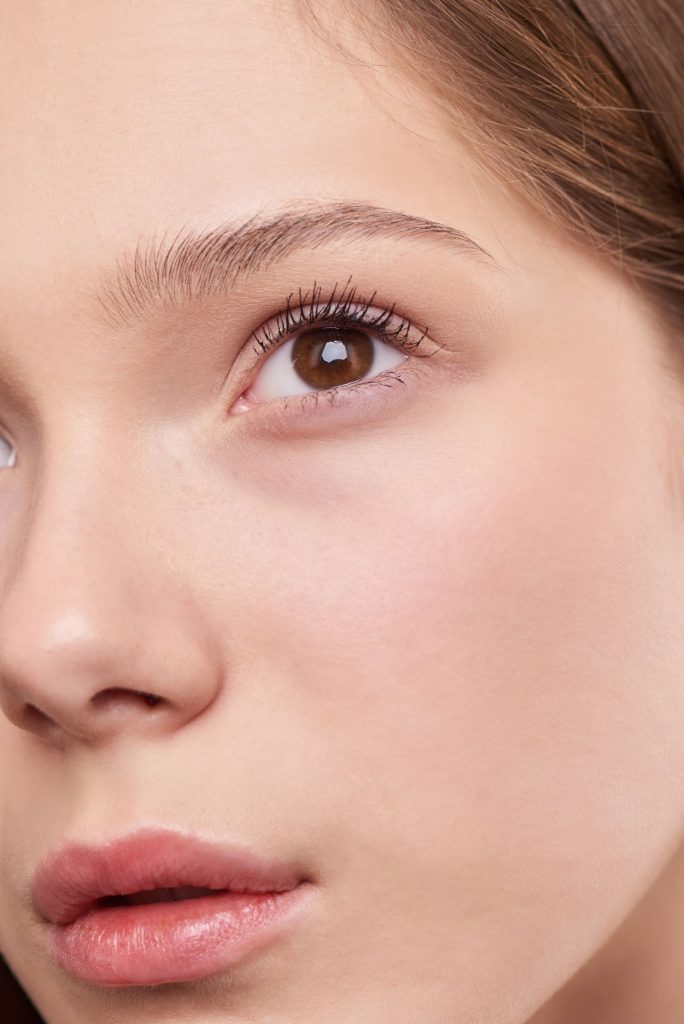 Close-up portrait of a woman with smooth, healthy skin