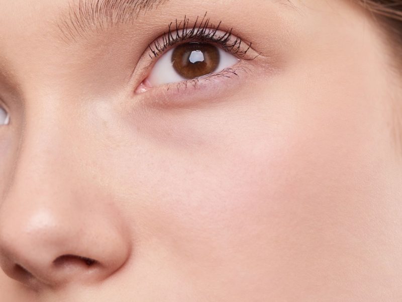 Close-up portrait of a woman with smooth, healthy skin