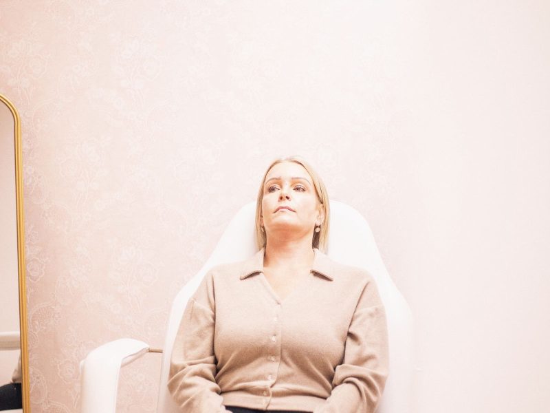 Woman relaxing in a modern medical spa lounge